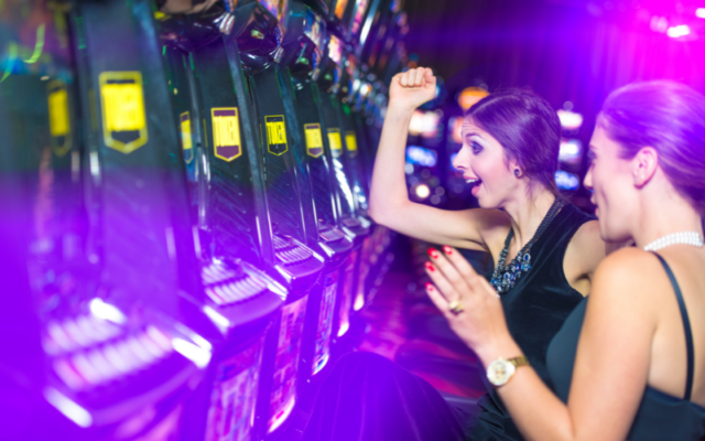 girls playing slot machine